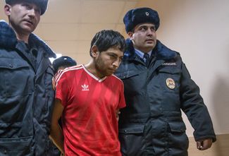 Один из участников банды, Абдумуким Мамадчонов, вскоре после ареста в Коптевском районном суде в Москве, 7 ноября 2014 года